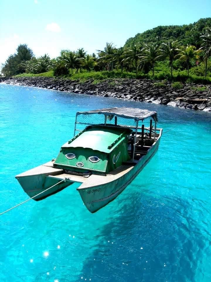 An alia catamaran moored in clear turquoise water